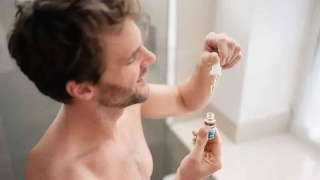 a man just taking cbd dosage of cbd oil from british cannabis